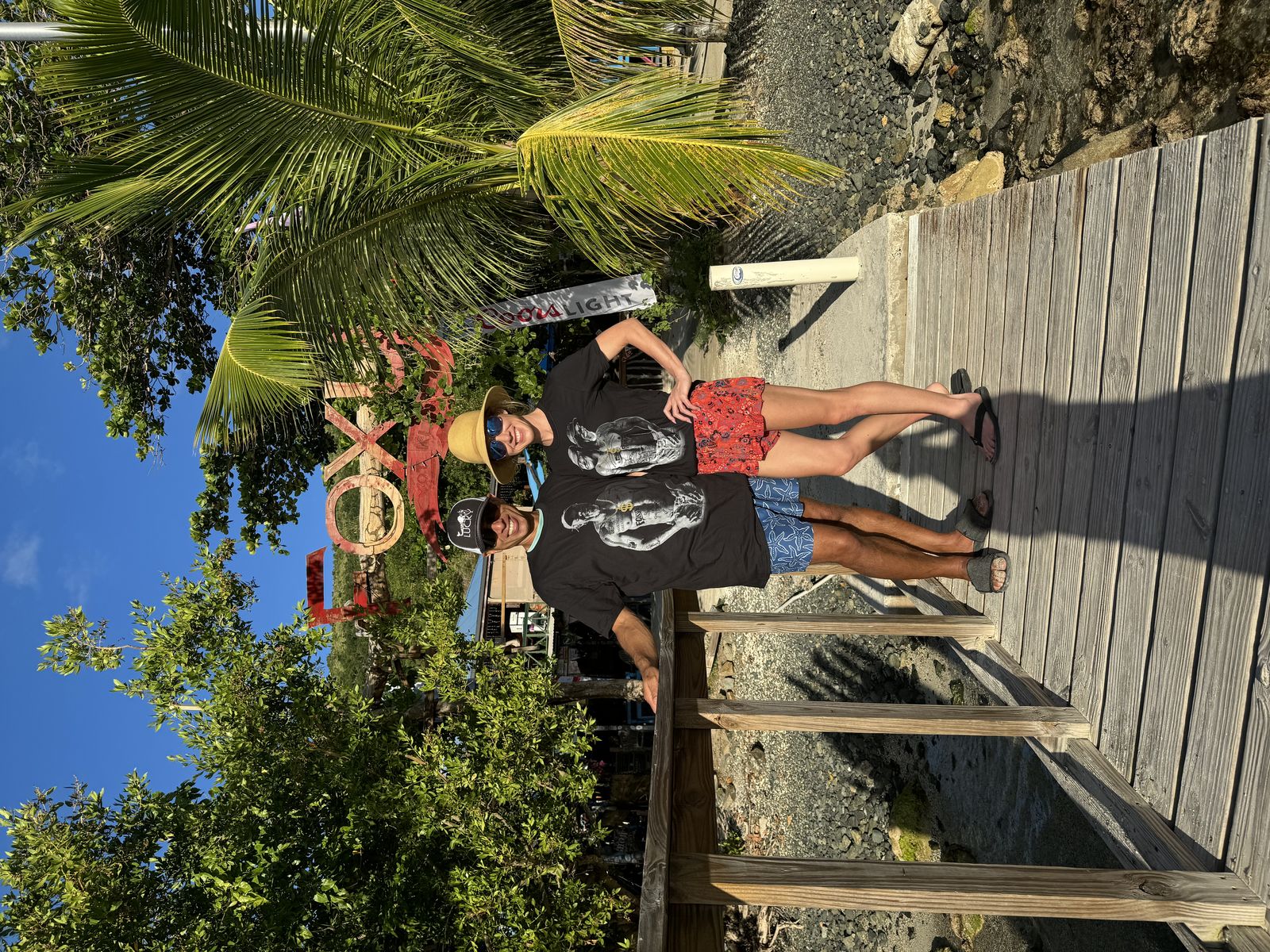 Guests at a beach-bar wooden dock